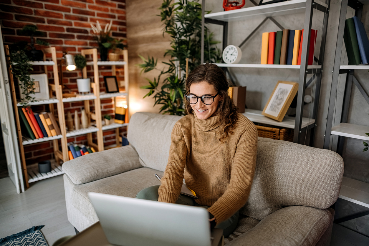 Woman using laptop at home